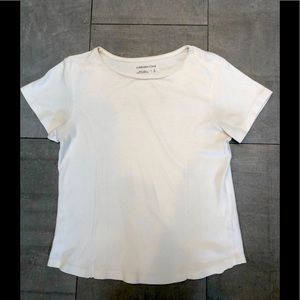 Off white top w seaming detail adds interest! So versatile: wear solo or layer!